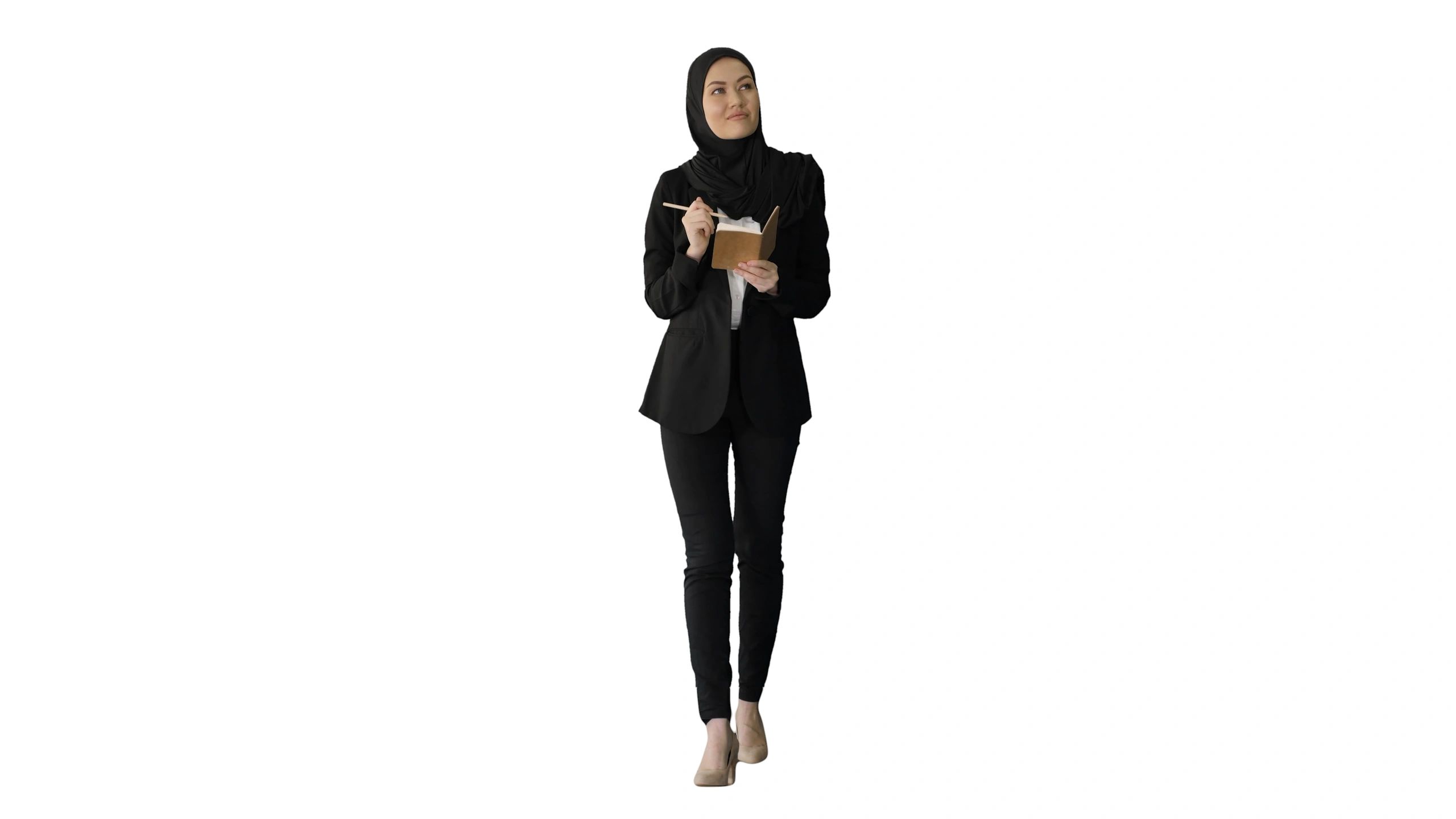 Professional woman writing notes in a planner