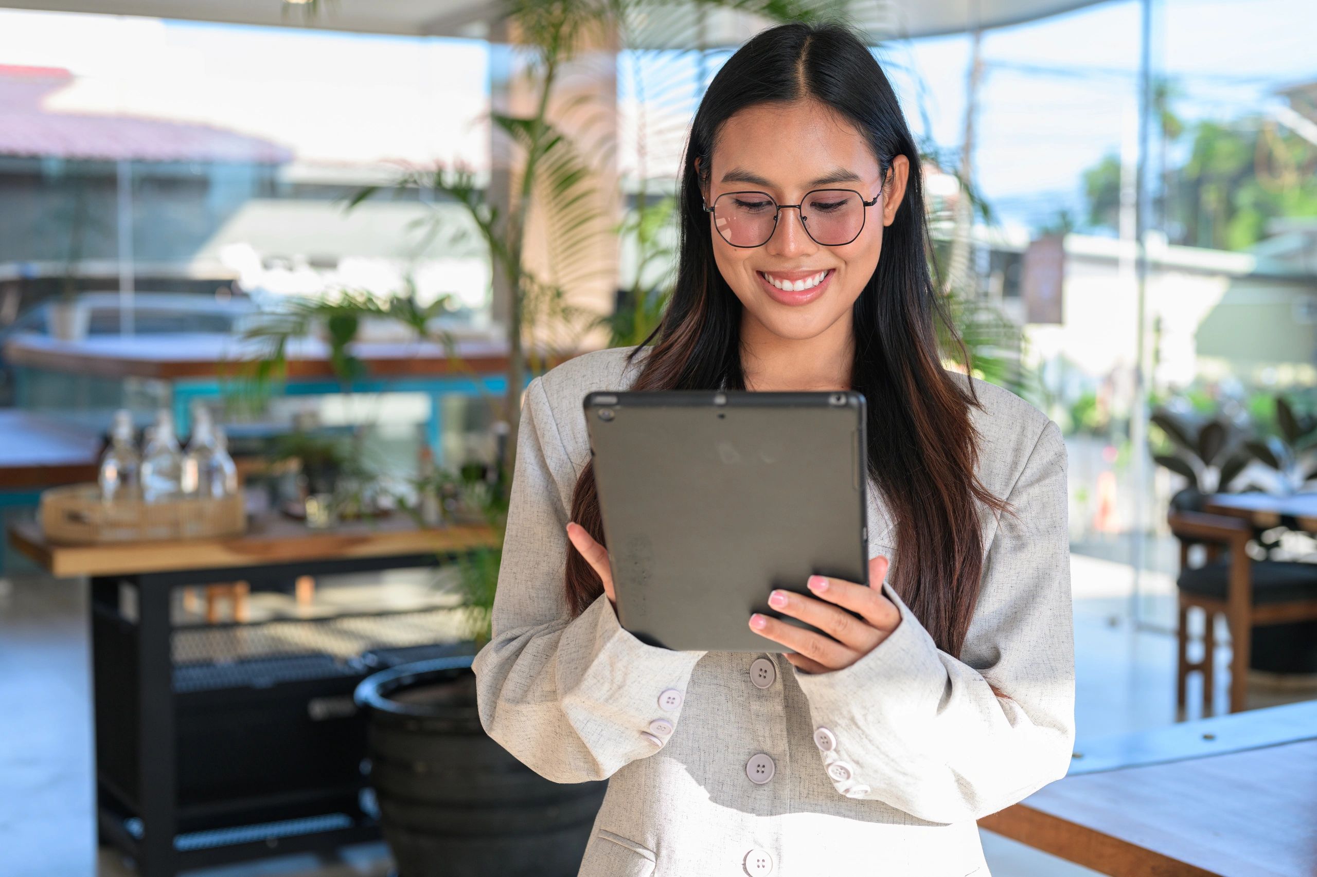 Customer using a tablet in a cafe